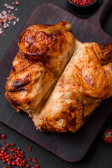 Crispy delicious whole baked chicken with vegetables, salt and spices