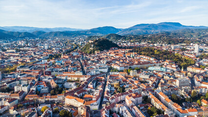 Aerial view of the city of Graz with the city centre and the landmark Schloßberg in the background