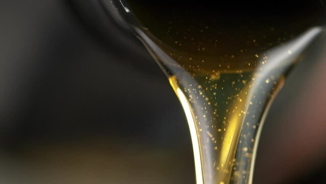 Super Slow Motion of Pouring Fresh New Motor Oil into Car's Engine. Filmed on High Speed Cinema Camera at 1000 fps.