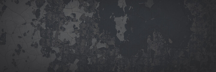 Dark wide panoramic background. Peeling paint on a concrete wall. Faded dark texture of old cracked flaking paint. Weathered rough painted surface with patterns of cracks. Shaded background for design