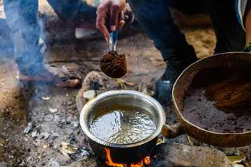 Preparing coffee in Chagga tribe near the Moshi town - obrazy, fototapety, plakaty