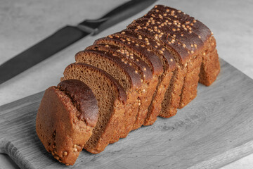 sliced rye bread with coriander pieces on the table