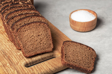 sliced rye bread with coriander pieces on the table