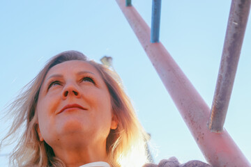 street portrait of a cute adult woman of European appearance, natural blonde, selective focus