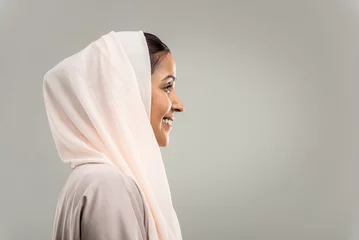 Muurstickers Arabian beautiful woman wearing traditional middle-eastern abaya portrait on isolated background © oneinchpunch