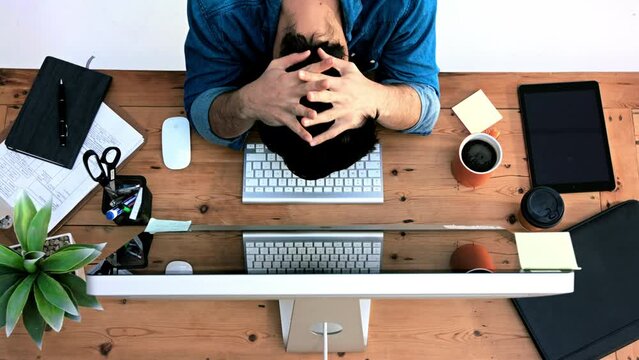 Research, computer and stress with businessman from top view typing for idea, web design and policy. Exhausted, frustrated and 404 glitch with tired employee planning on keyboard in digital agency