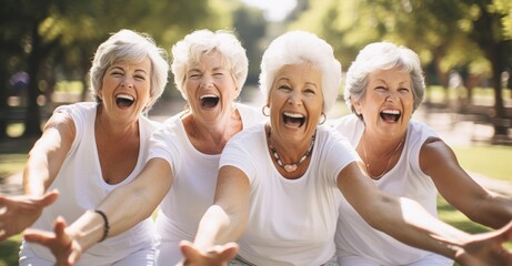 several senior women laughing heartily while having great time in a tranquil park