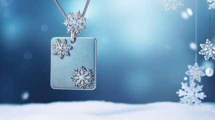 Fototapeta premium Jewelry chain with pendant suspended on a snowy background. Empty space for product placement or advertising text.