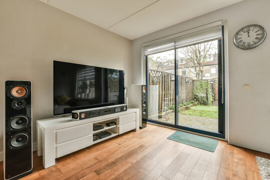 Living room with television and large window