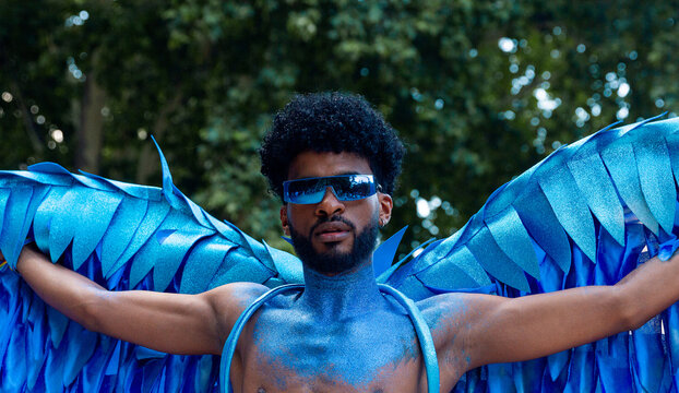 Man LGTBIQ+ in blue winged pride display