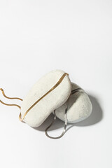 Jewelry made of gold and silver on a white background. Stylish compositions with hard shadows and natural stones. 