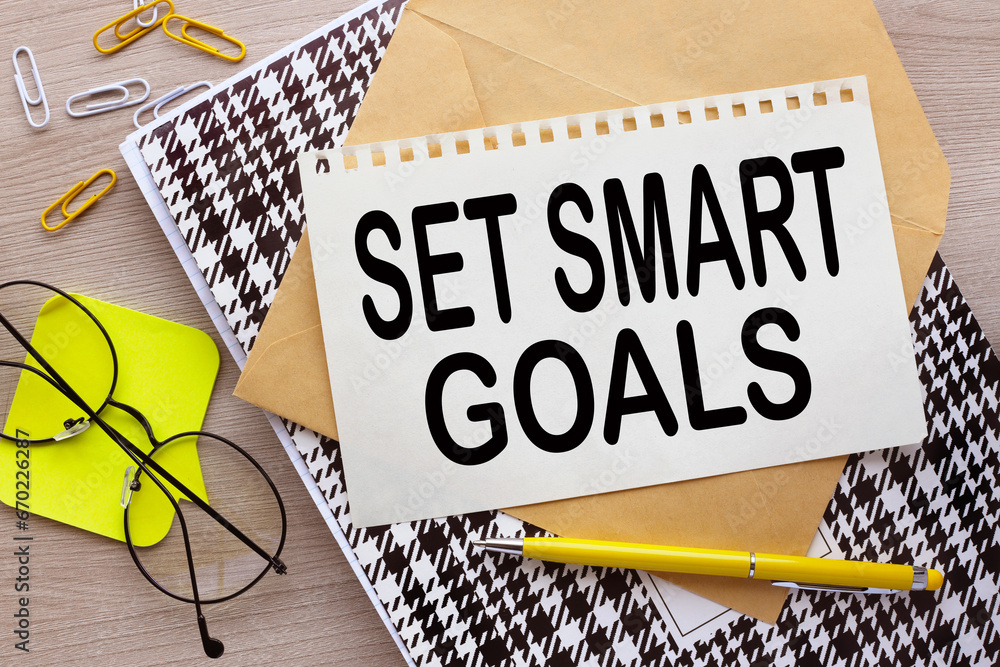 Poster set smart goals top view of a torn page on an envelope. word on the page