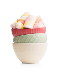 Sweet colorful marshmallows in bowl isolated on white background.