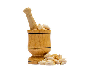 Garlic press with garlic grains vertical shot on white isolated background 