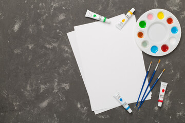 Painting tools on concrete background, top, view
