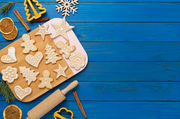 Flat lay with cute homemade Christmas cookies on wooden background,top view