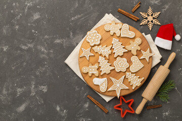 Flat lay with cute homemade Christmas cookies on concrete background,top view