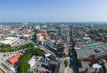 Obraz premium Preston, Lancashire, UK, September 06, 2023; high aspect aerial view of Fishergate high street shopping and over the town cityscape of Preston, Lancashire, England.