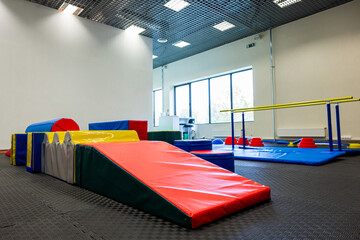 Colorful Gymnastic Equipment in Modern Training Room Kid's Physical Development Zone