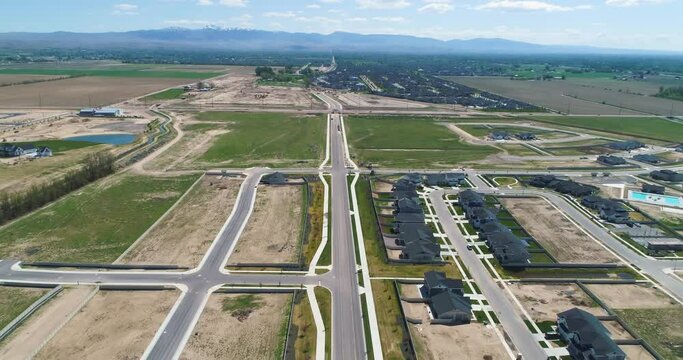 Aerial view of new residential neighborhood being built next to an existing residential community