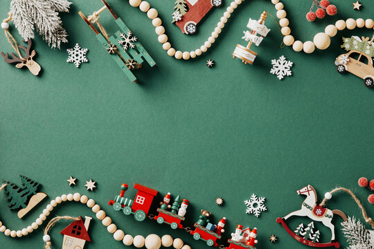 Vintage green Christmas background with wooden painted toys. Retro Christmas card template.