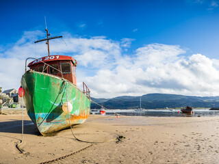 Fishing boat at low tide
