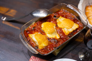 Hearty lunch, cooked xanfaina cod with seasonal vegetables in baking dish. Healthy food,...