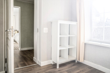 Bright room, shelving. The window is sunny.