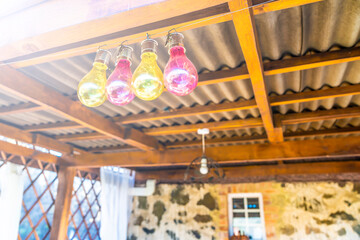 Sunny day, colorful lamps, canopy in nature.