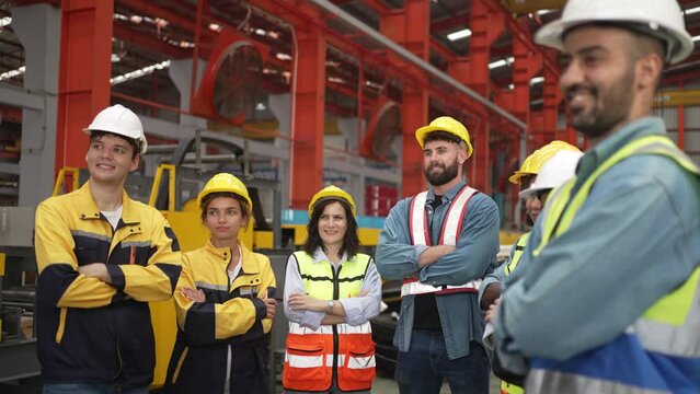 Blue collar worker work at metal sheet factory.