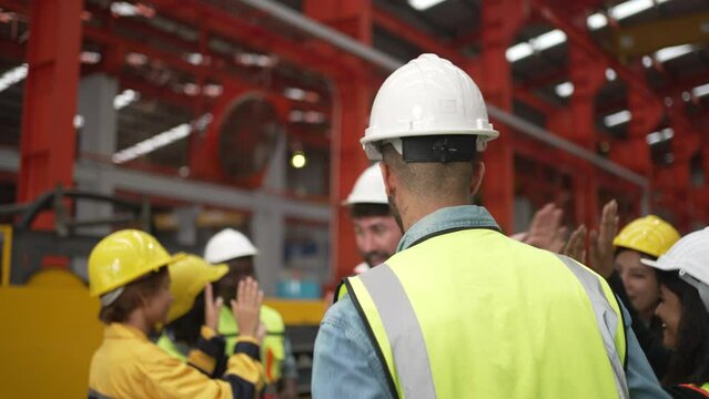 Blue collar worker work at metal sheet factory.