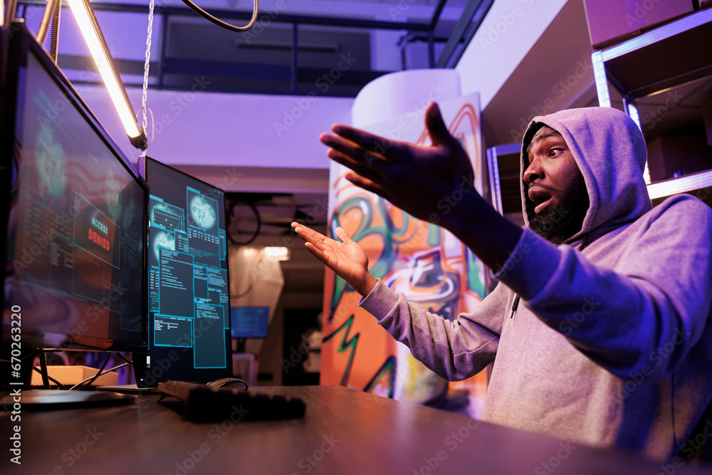 Poster angry hacker failing to pass computer security system while hacking online server. african american 