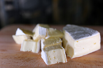 Coulommiers charactere, camembert and brie cheese fresh healthy meal food snack diet on the table. copy space food background rustic