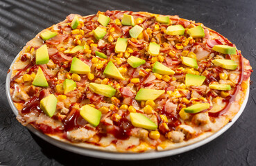 BBQ chicken pizza - Neapolitan sauce and cheese base. Fusion of chicken, bacon, corn, avocado with BBQ sauce