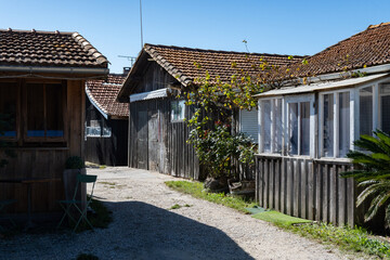 View on old fisherman's houses and oysters farms, Arcachon Bay near Le Phare du Cap Ferret, Cap Ferret peninsula, France, southwest of Bordeaux, France's Atlantic coastline