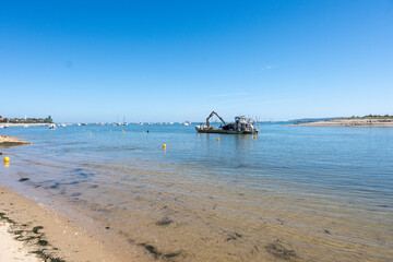View on Arcachon Bay with many fisherman's boats and oysters farms near Le Phare du Cap Ferret, Cap...