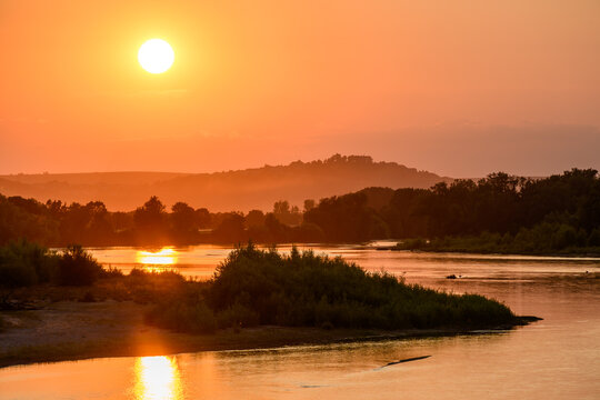 View from Pont de Pouilly-sur-Loire bridge 496 km from the source and 496 km from the mouth of the Loire river near Pouilly-sur-loire, Central France ar sunset