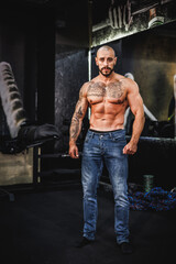 Fototapeta na wymiar Bodybuilder Posing At The Gym