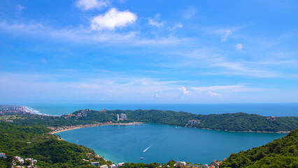 Fototapeta na wymiar Aerial view of Puerto Marques Bay and Punta Diamante, a small bay in Acapulco city, Mexico