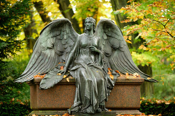 beautiful angel with spread wings on the autumnal melaten cemetery in cologne