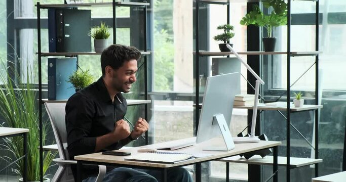 Close-up shot highlights the skillful fingers of a man as he types on a keyboard. The precision and efficiency of his movements underscore the importance of modern technology in the workplace.