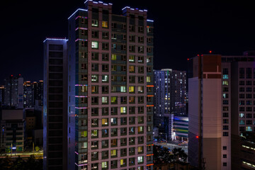 Modern city buildings and skyline at night, dark deserted skyscrapers, post-corvid era cityscape