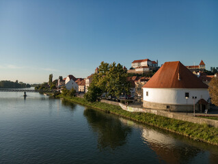 Naklejka na ściany i meble Ptuj in Slovenia, panoramic view with river Drava in foreground.