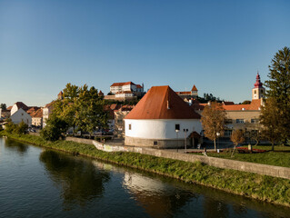 Naklejka na ściany i meble Ptuj in Slovenia, panoramic view with river Drava in foreground.