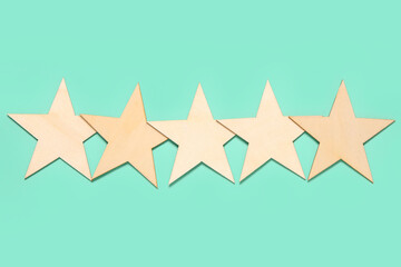 Five stars rating on turquoise background. Customer experience concept