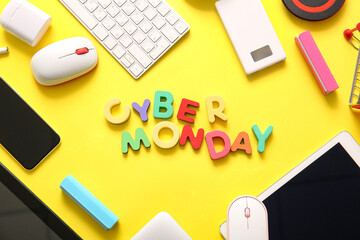 Text CYBER MONDAY made of colorful letters and different gadgets on yellow background