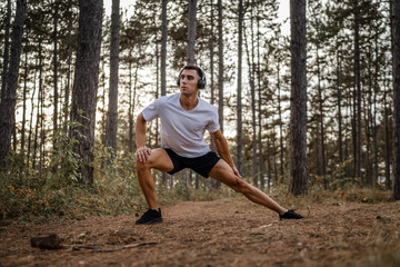 one man male athlete stretch in nature