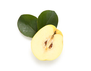 Half of fresh quince with green leaves on white background