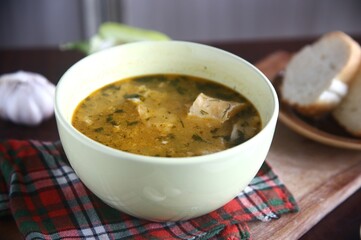bowl of yummy soup with bread and garlic