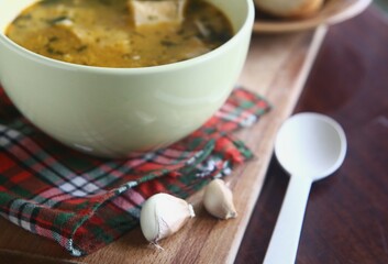 close up soup with bread and garlic